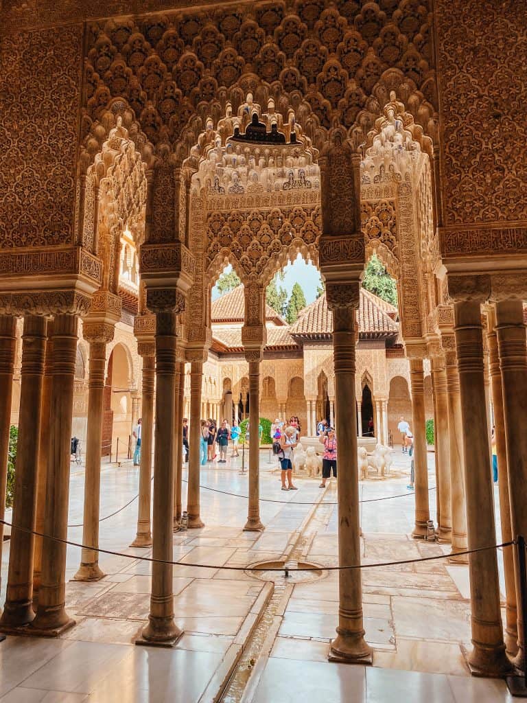 Intricate decorated columns at Nasrid Palace, tours from Seville to Granada