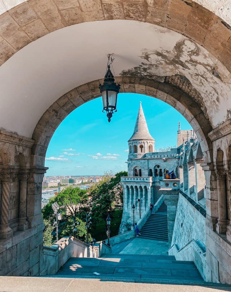 View of a tower through a gate at Fisherman's Bastion in Budapest
