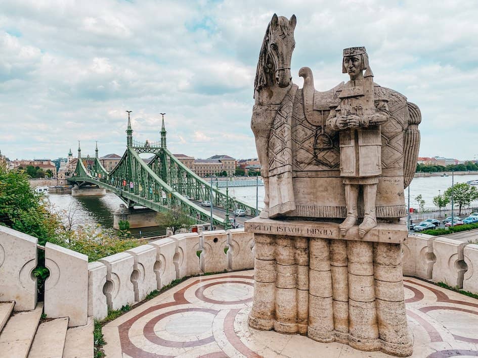 Statue of a horse and man, in front of the Liberty Bridge in Budapest