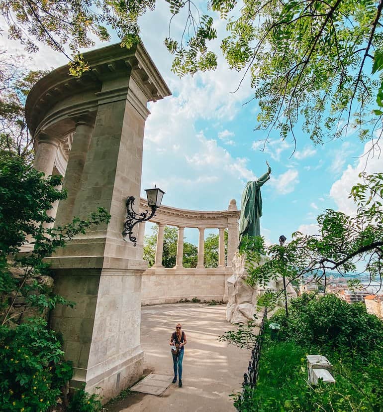 A colonnaded structure and a statue on Gellert Hill in Budapest