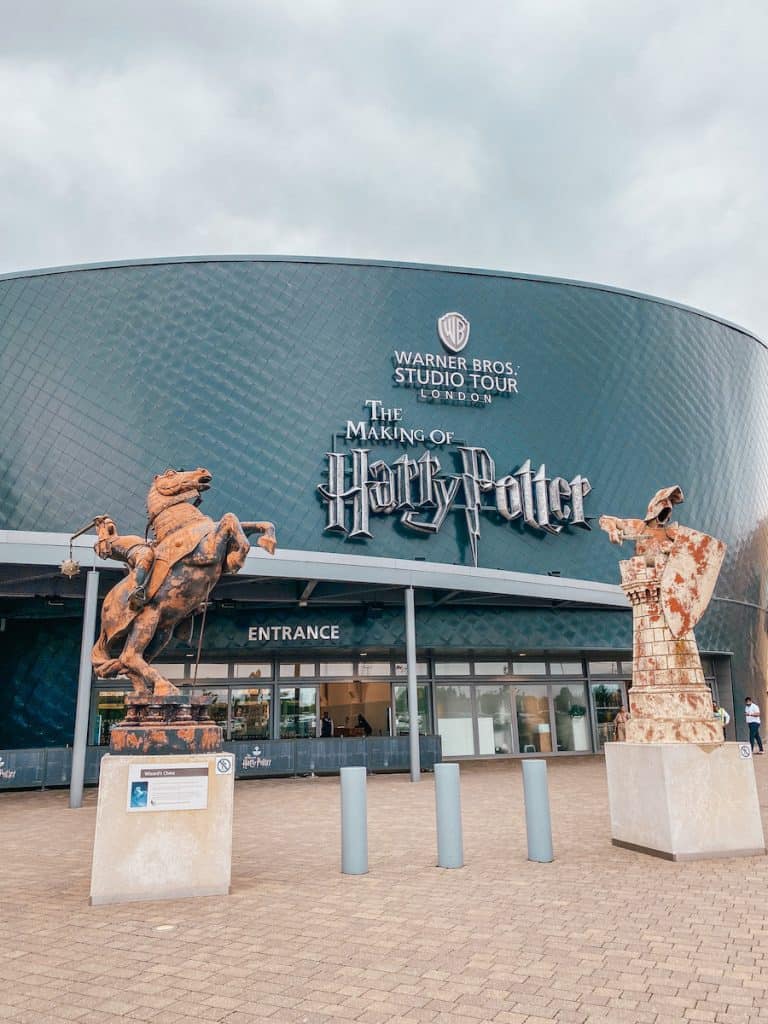 The Making of Harry Potter from the outside. Two gigantic chess figures standing in front of it.