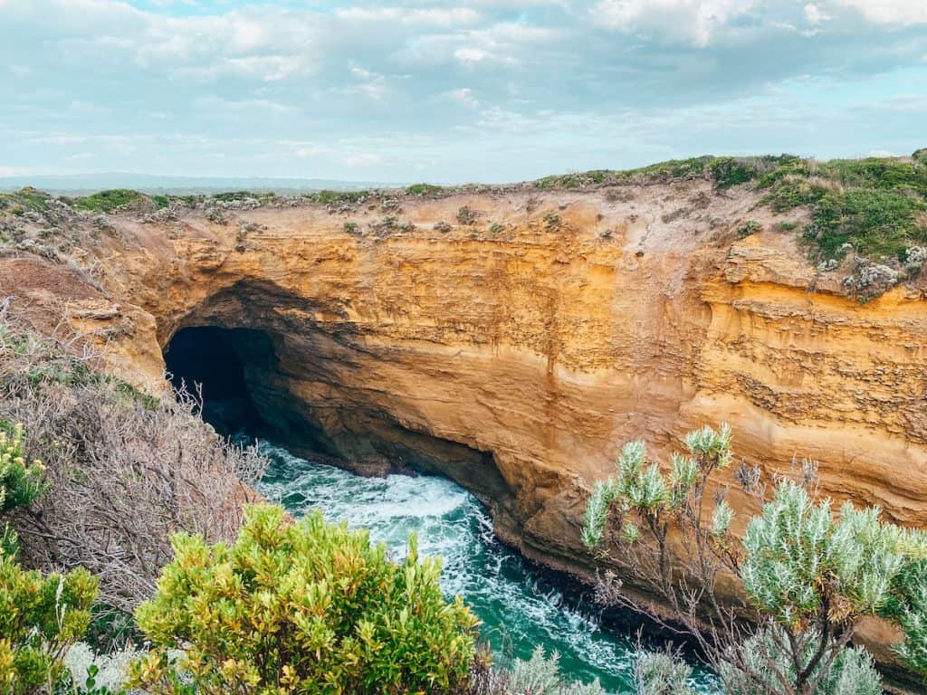 A big cliff with a cave