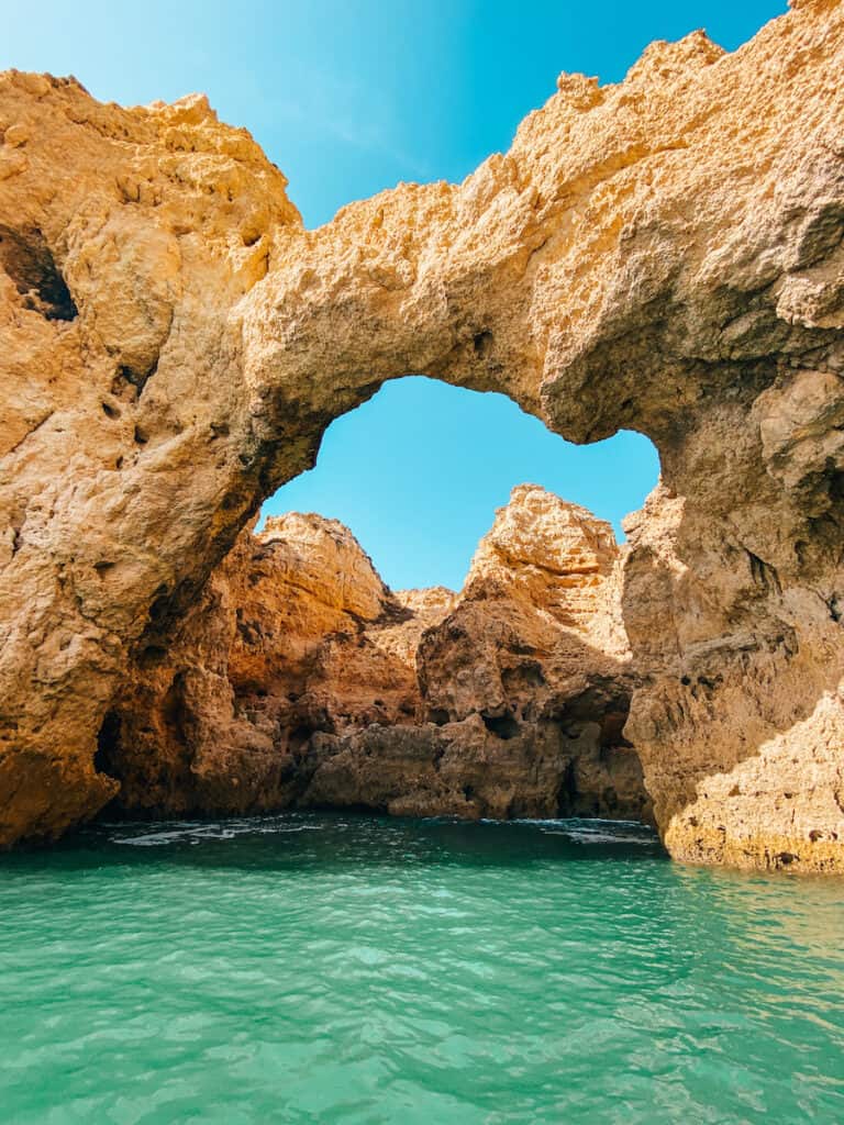 A limestone arch in the ocean just outside Lagos, which you can visit on one of the tours to Algarve from Lisbon
