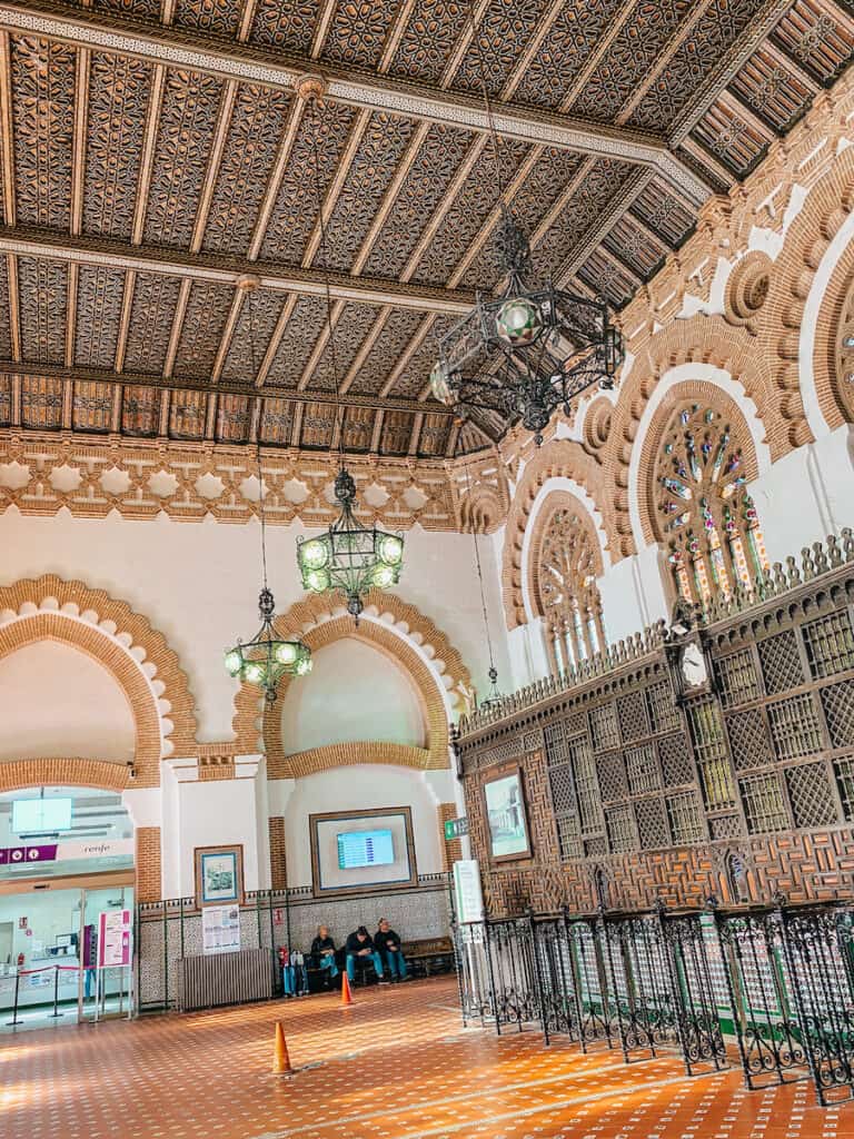 The train station in Toledo from the inside with an intricate wooden ceiling; the train is the best way how to get from Madrid to Toledo