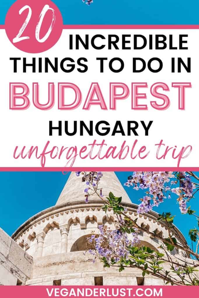 Promotional graphic for Veganderlust.com highlighting '20 Incredible Things to Do in Budapest, Hungary for an unforgettable trip' with a vibrant image of a historical building's dome adorned with arches and a flowering wisteria in the foreground.