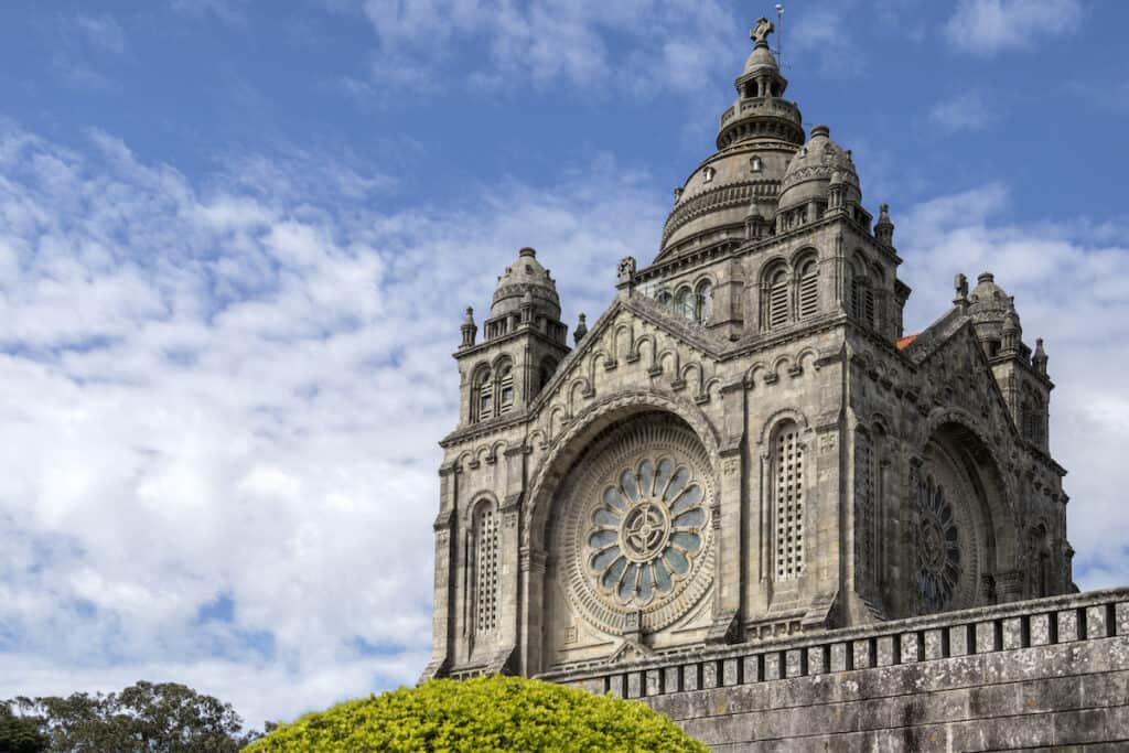The ornate Viana do Castelo Sanctuary, one of the top architectural sights in North Portugal, under a cloudy blue sky, representing a must-visit cultural landmark.