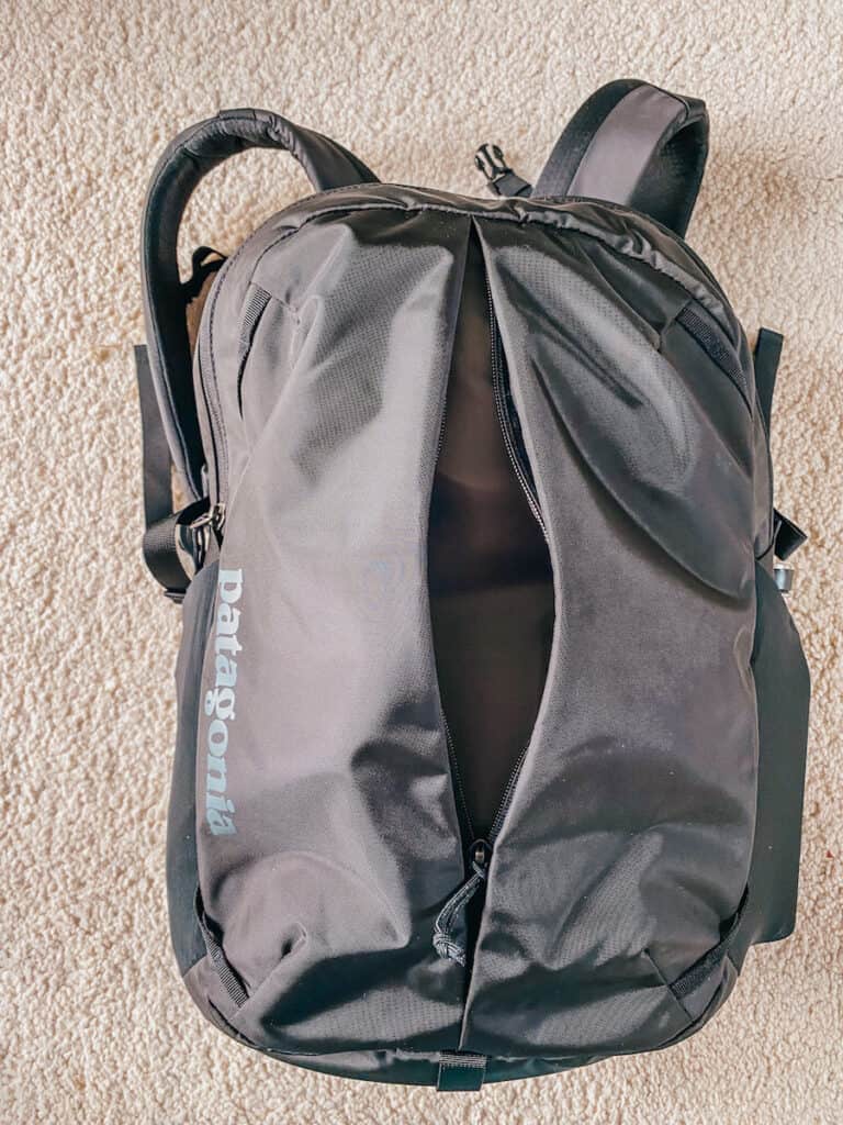 The front view of a Patagonia Refugio 26L backpack, showing its clean lines and the iconic logo, ready for a review of the Patagonia Refugio backpack.