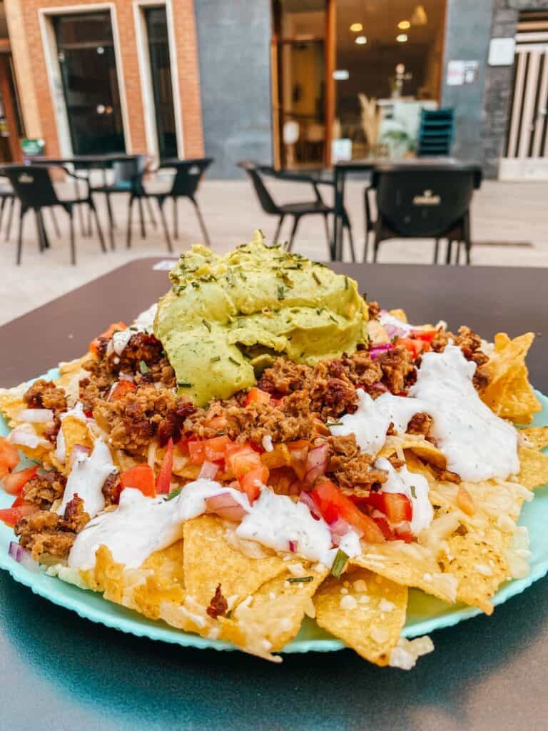 A plate of vegan nachos at a vegan restaurant in Murcia