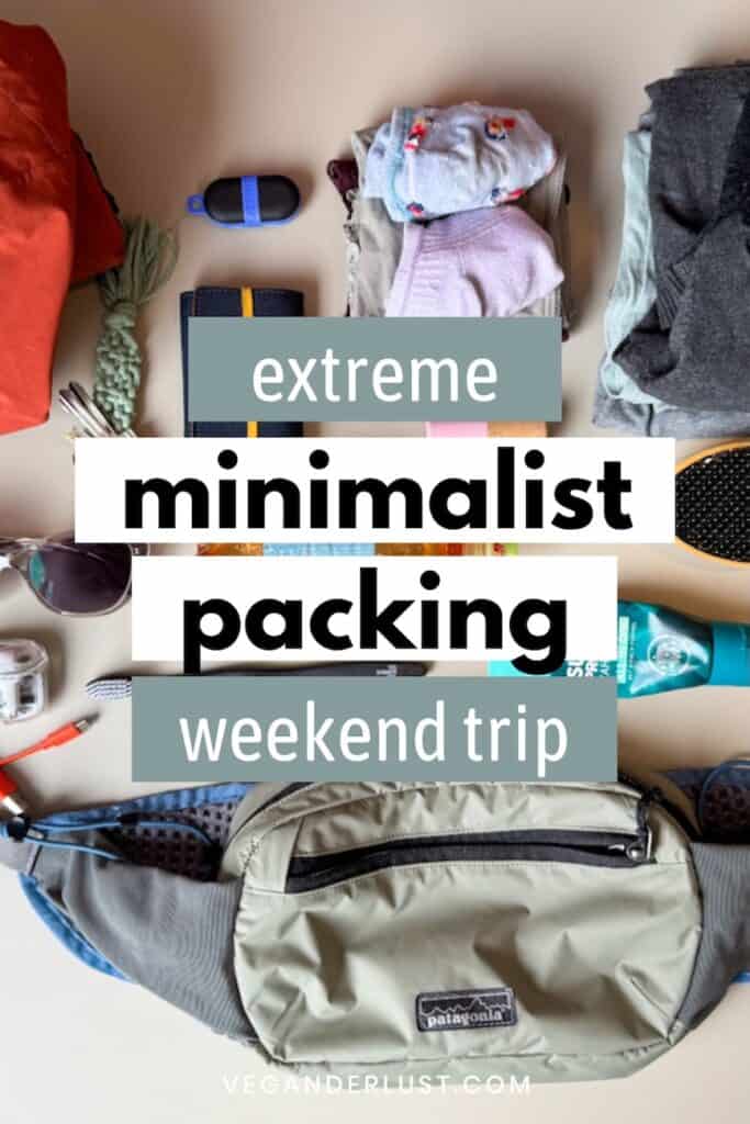 Flat lay of ultra-light packing essentials for a weekend trip, arranged around a sage green Patagonia waist pack. Items include rolled-up clothes, socks, a small hairbrush, sunglasses, a compact deodorant, a toothbrush, charger cords, and a few toiletries. Text overlay reads “extreme minimalist packing – weekend trip,” and the image is branded with “veganderlust.com” at the bottom.