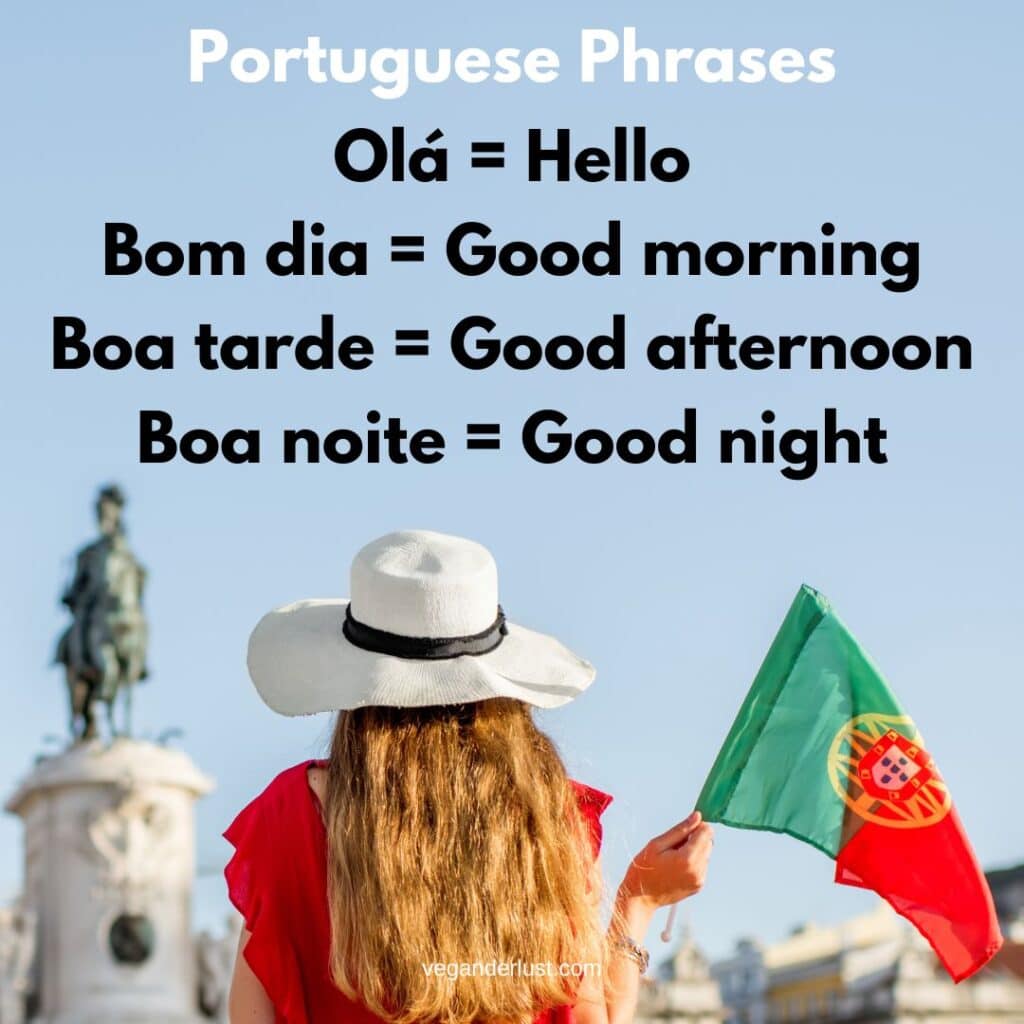 Graphic with the heading "Portuguese Phrases" showing translations including "Olá = Hello", "Bom dia = Good morning", "Boa tarde = Good afternoon", and "Boa noite = Good night", above a woman in a white hat holding a Portuguese flag in a sunny city square.